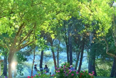 a group of people in a park with trees and flowers at Le Mas Sérénité in Ansouis
