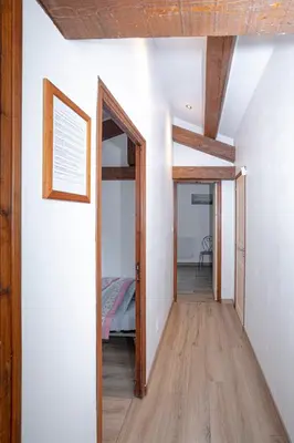 a hallway with a door leading to a bedroom at Le Clos Zinou in Lambesc