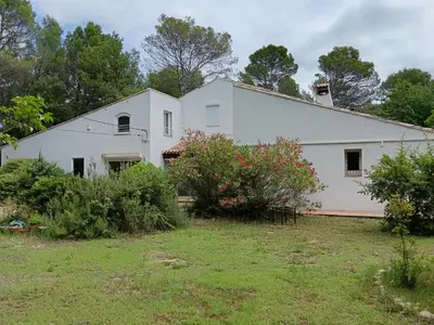 a large white building with a yard at Le Clos Zinou in Lambesc