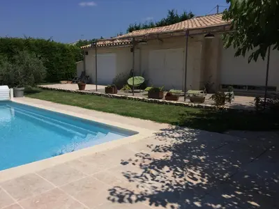 a house with a swimming pool in a yard at Le Mazet Des Joncs en Provence in Saint-Pierre-de-Vassols