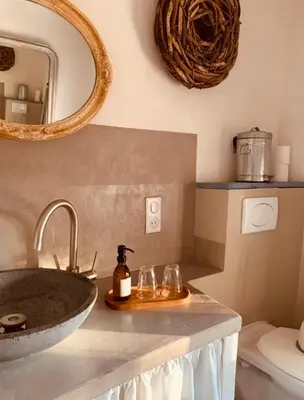 a bathroom with a sink and a mirror at Le Vieux Portail in Saint-Saturnin-les-Apt