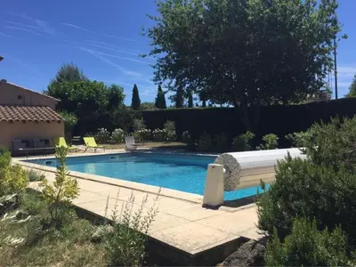 a swimming pool in a yard with a house at Vakantiehuis Mazan - Le Haut Colombier in Mazan