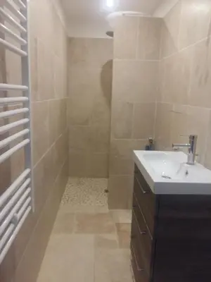a bathroom with a sink and a shower at les oliviers in Carpentras