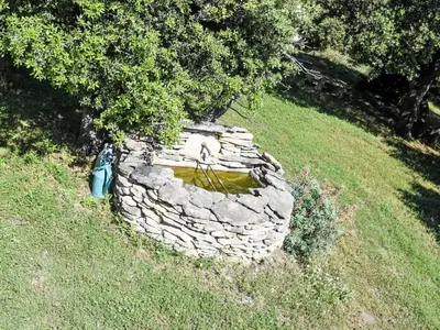 a stone wall with a tree on top of it at Villa La Chênaie by Interhome in Saumane-de-Vaucluse