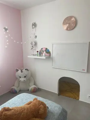 a room with a teddy bear sitting on the floor at Villa Le Luberon in Mérindol