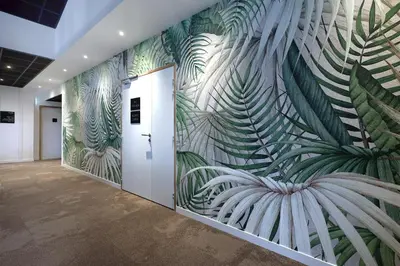 a hallway with a wall mural of plants at Le Néliö in Aix-en-Provence