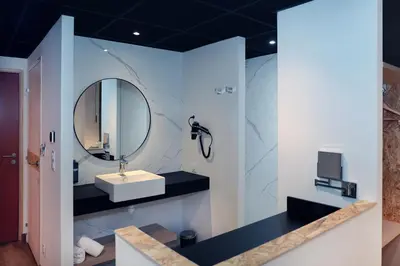 a bathroom with a sink and a mirror at Le Néliö in Aix-en-Provence