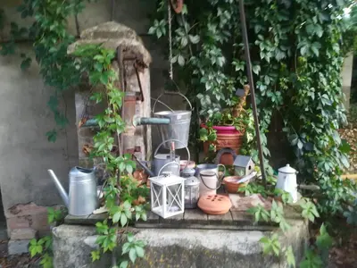 a bunch of pots and pans sitting on a ledge at Rêve d’Emma in Plan-dʼOrgon
