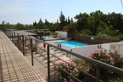 a lobby of a restaurant with chairs and a counter at Sweet Home Studio Aix en Pce, clim,terrasse,piscine,pkg gratuit in Aix-en-Provence