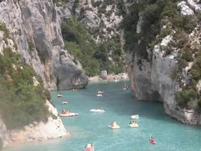 a group of people rafting down a river in a canyon at Fleur des îles in Saint-Michel-lʼObservatoire