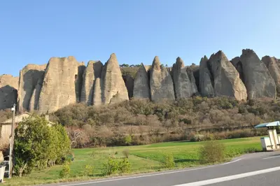 a road in front of a large rock formation at Fleur des îles in Saint-Michel-lʼObservatoire