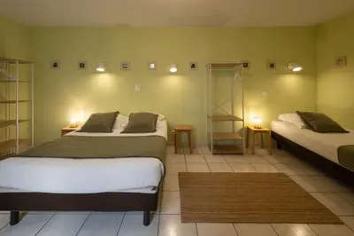 a bathroom with a toilet and a sink at L'Aptois Hôtel in Apt