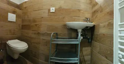 a bathroom with a sink and a toilet at Victoire Appartement in Aix-en-Provence