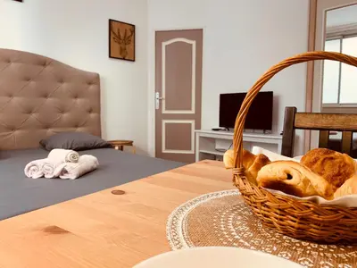 a basket of bread sitting on top of a table at Victoire Appartement in Aix-en-Provence