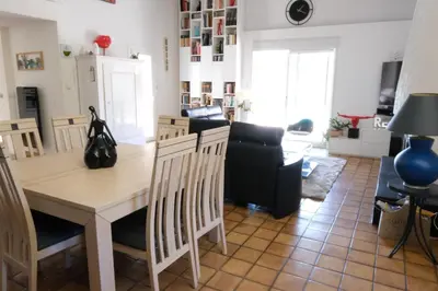 a kitchen and living room with a table and chairs at pleasant one-level villa with private pool in the thor village, close to l'isle sur la sorgue - 6 persons in Le Thor