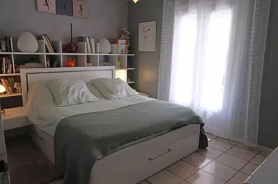 a bedroom with a bed and a window and shelves at pleasant one-level villa with private pool in the thor village, close to l'isle sur la sorgue - 6 persons in Le Thor