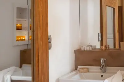 a bathroom with a sink and a mirror at Maison Dauphine in Aix-en-Provence