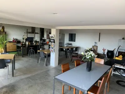 a living room and kitchen with tables and chairs at Metafort in Méthamis