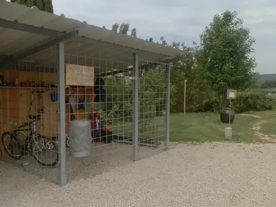 a gate with a bike inside of a building at Moulin d'Antelon B&B in Crillon-le-Brave