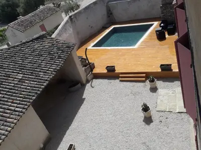 an overhead view of a swimming pool on a roof at Le Temps d'un Rêve in Mazan