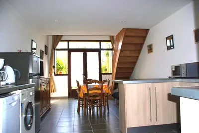 a kitchen with a table and chairs in it at Gite le Mas de l'Amandier in Saint-Saturnin-lès-Avignon
