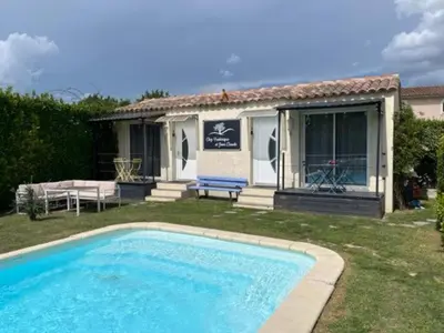 a house with a swimming pool in the yard at Chez Frédérique et Jean-Claude in Les Taillades