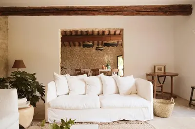 a building with a tree in front of it at Le Galinier Lourmarin, a Beaumier Guesthouse in Lourmarin