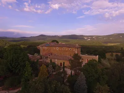 an aerial view of a building in the middle of a field at Les Jardins de l'Abbaye in Simiane-la-Rotonde