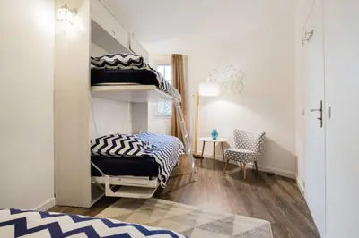 a bedroom with a bunk bed and a desk at LEYDET in Aix-en-Provence