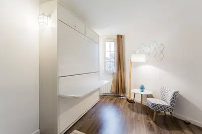 a white room with a desk and a chair at LEYDET in Aix-en-Provence
