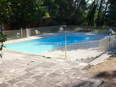 a swimming pool with a fence around it at Villa Célestine in Roussillon