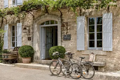two bikes parked in front of a building at Hotel Crillon le Brave in Crillon-le-Brave