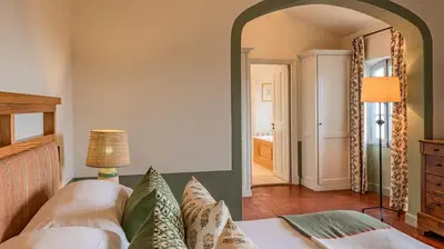 a bedroom with a bed and a mirror at Hotel Crillon le Brave in Crillon-le-Brave