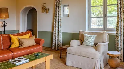 a living room with a couch and two chairs at Hotel Crillon le Brave in Crillon-le-Brave