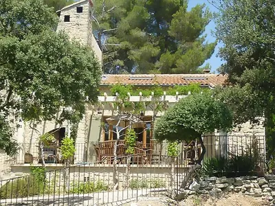 a house with a fence in front of it at Villa in Crillon-le-Brave near Mont Ventoux in Crillon-le-Brave