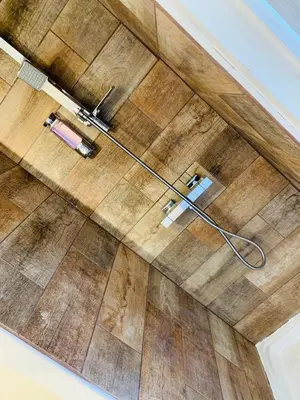 an overhead view of a bathroom floor with a hose at COURONNE STUDIO in Aix-en-Provence