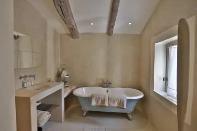 a bathroom with a tub and a sink at Villa Sunset in Gordes in Gordes