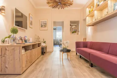 a living room with a couch and a table at Le Concorde in Aix-en-Provence