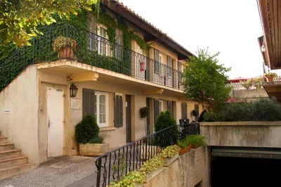 an apartment building with a balcony and a door at Le Concorde in Aix-en-Provence
