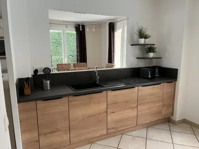 a kitchen with a sink and a counter top at Golf de Pont Royal Villa du Lac climatisée 3 chambres Piscine chauffée Parking et Garage in Mallemort