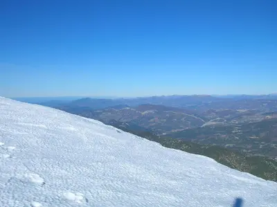 a snow covered mountain with a view of a valley at Le Mas des Baux in Bédoin