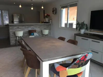 a kitchen with a dining table and chairs at Beautiful provencal vacation rental in L'Isle sur la Sorgue in LʼIsle-sur-la-Sorgue