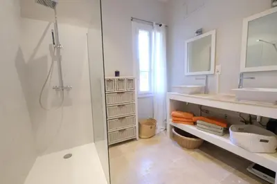 a white bathroom with a shower and a sink at superb prestigious mas with pool in the countryside of caumont sur durance, close to avignon, sleeps 8 in Caumont-sur-Durance