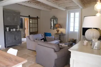a living room with two couches and a table at superb prestigious mas with pool in the countryside of caumont sur durance, close to avignon, sleeps 8 in Caumont-sur-Durance