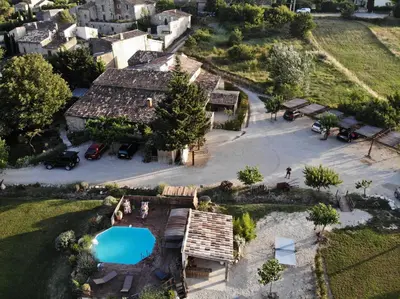 an aerial view of a house with a swimming pool at Lou mas li Pitchoun 