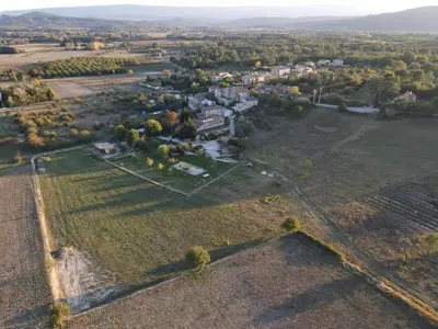 an aerial view of an estate with a large field at Lou mas li Pitchoun 