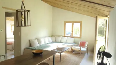 a living room with a couch and a table at La petite maison in Aix-en-Provence