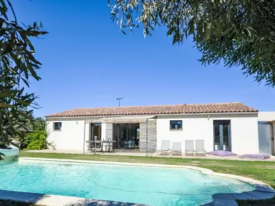 a house with a swimming pool in front of it at Holiday Home L'Oliveraie by Interhome in Saint-Didier