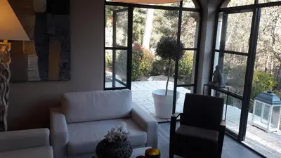 a living room with a couch and a chair at Les Oursillons in Roussillon