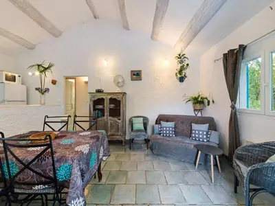 a living room with a bed and a couch at Modern holiday home with private pool in Lambesc